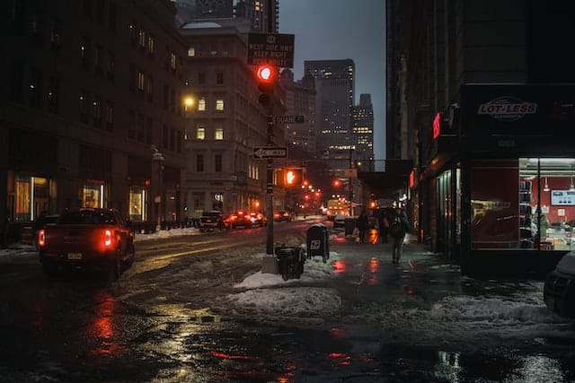 busy street corner in a big city at night