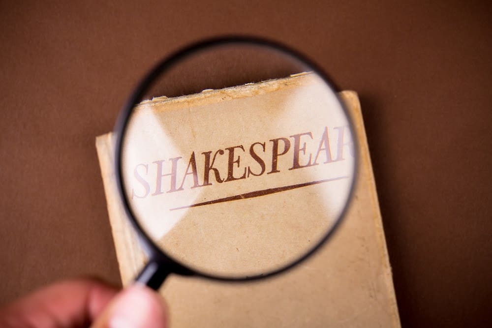 the word Shakespeare on a piece of paper and a magnifying glass