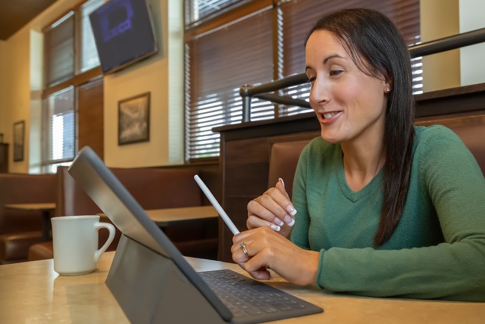 a woman reading dialogue out loud in a coffee shop