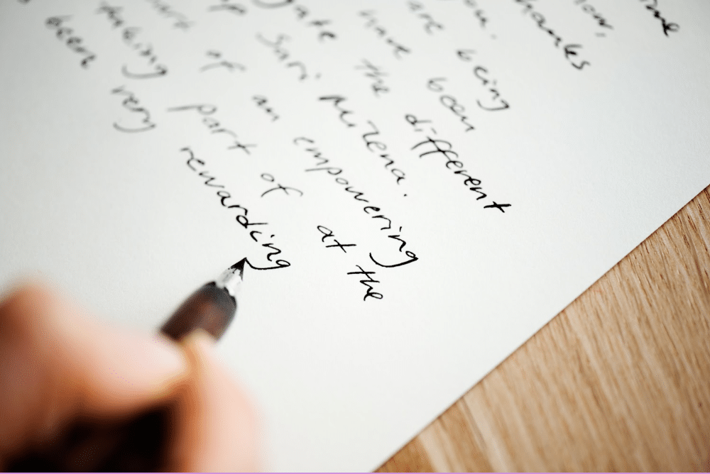 writing a first draft on paper with a felt tip pen