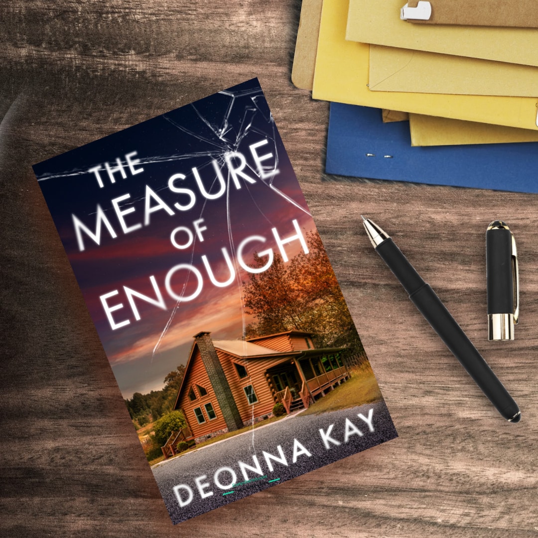 The Measure of Enough by Deonna Kay flatlay with files and a pen