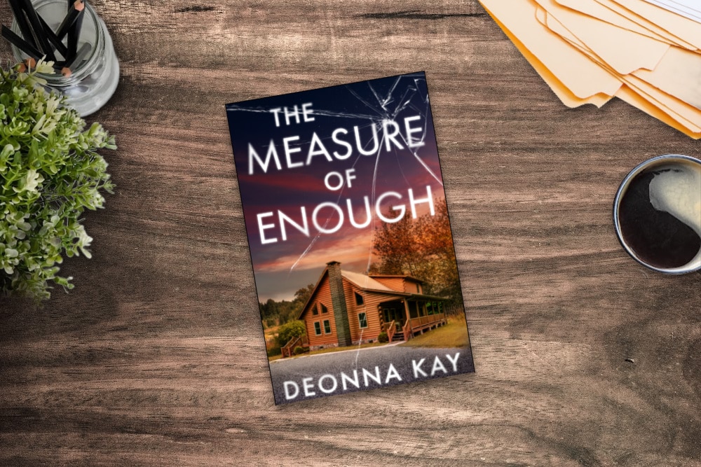 The Book Measure of Enough on a table with files, coffee, and plants