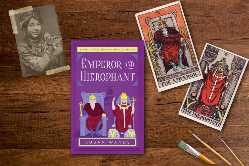 Emperor and Hierophant book on a table with tarot cards and a photo of Pamela Colman Smith